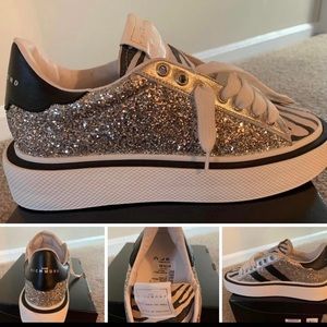 A pair of Brand New John Richmond sneakers.